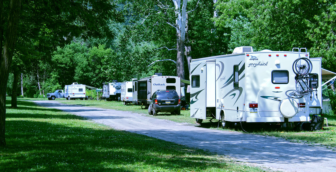 RV Site with Family sitting outside